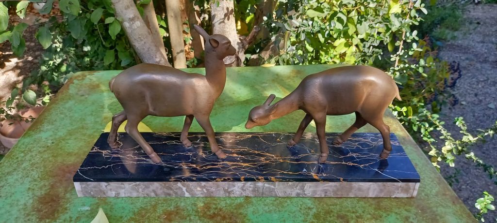 Pair of deer decorative sculptures on a marble base