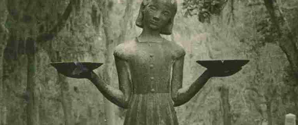 Young girl statue holding trays in a Savannah garden